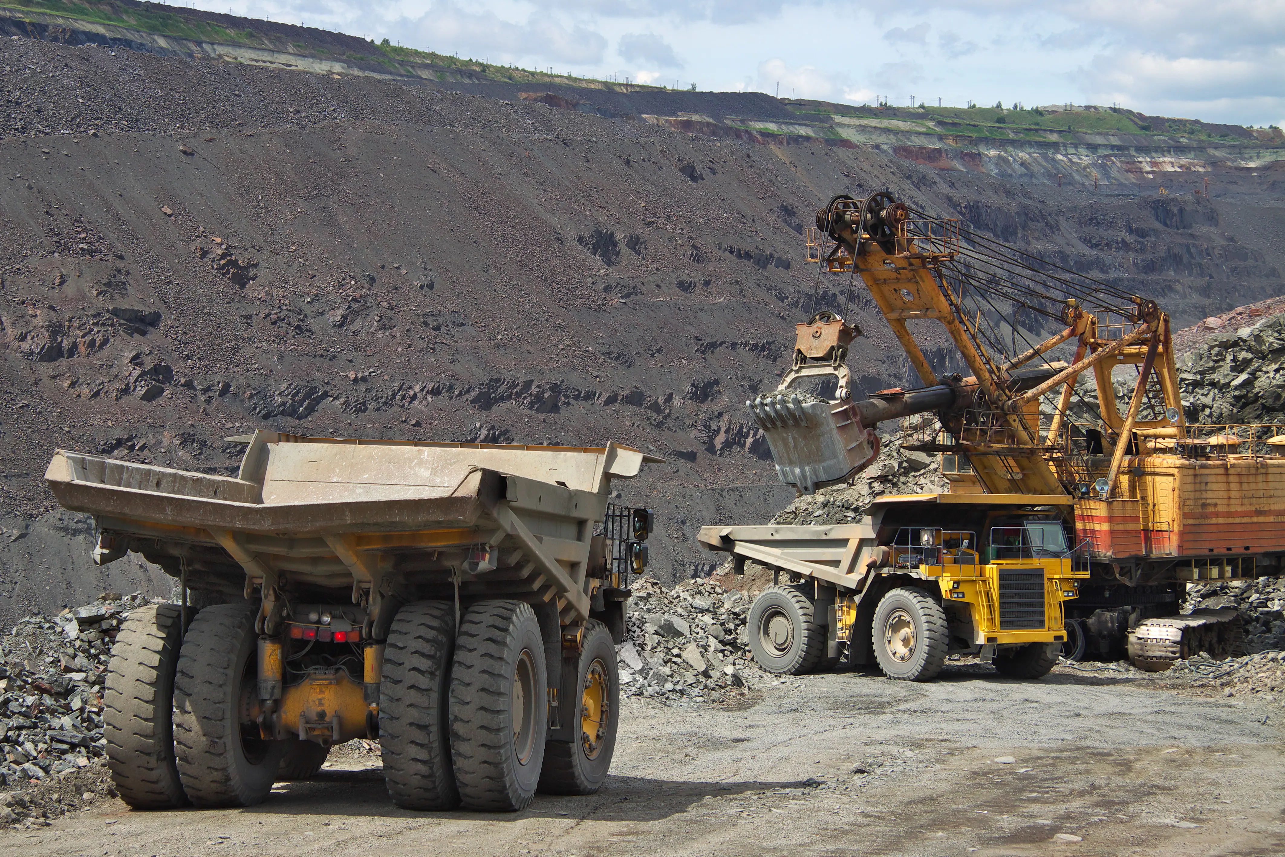 Mineral resources construction vehicles in a quarry.