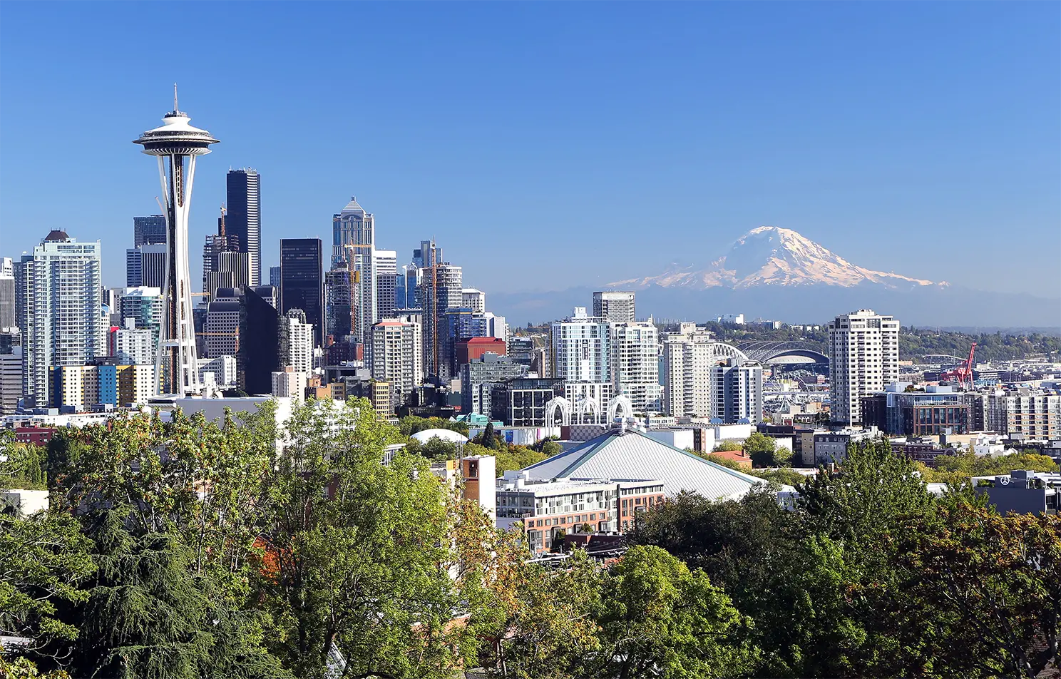 Skyline view of Seattle, WA, bordering the Puget Sound where the Puget Sound Human Factors and Ergonomics Society Annual Symposium is being held.