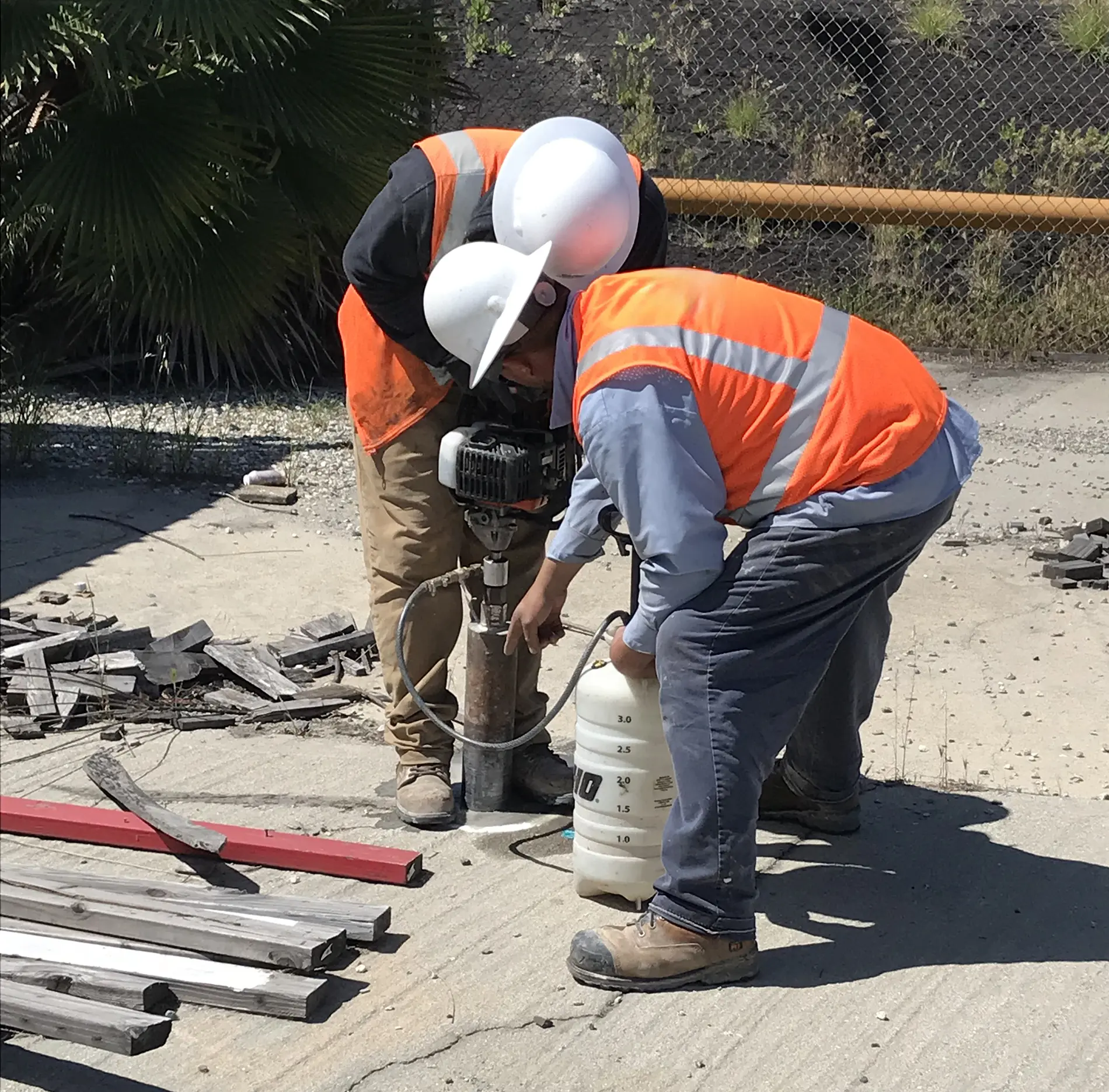 Apex workers performing a membrane interface probe investigation using a concrete core drill at the former Roehl Disposal Facility in Wilmington, California.