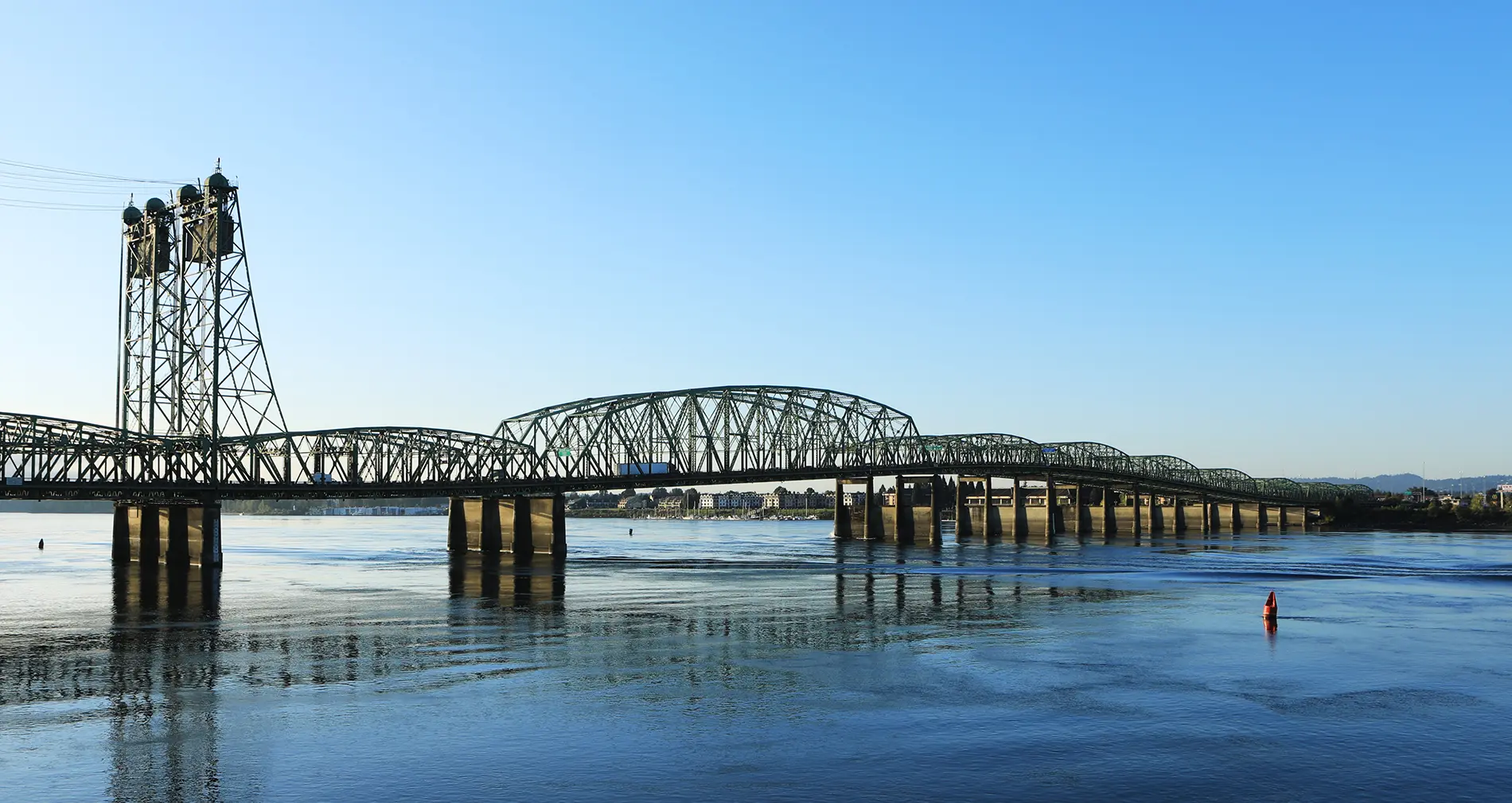 A bridge spanning the water over the Portland Columbia bridge, where Apex is attending the NEBC Conference & Expo.