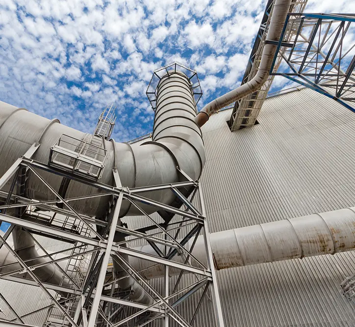 Air purification pipes at a metallurgical plant pointed toward the sky, whose emissions are subject to reporting