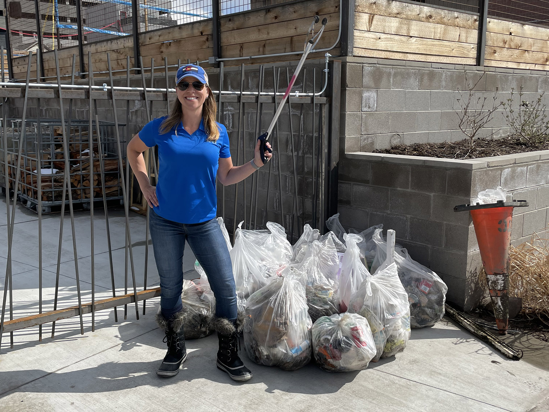 Apex employee donating time to her community to do litter cleanup