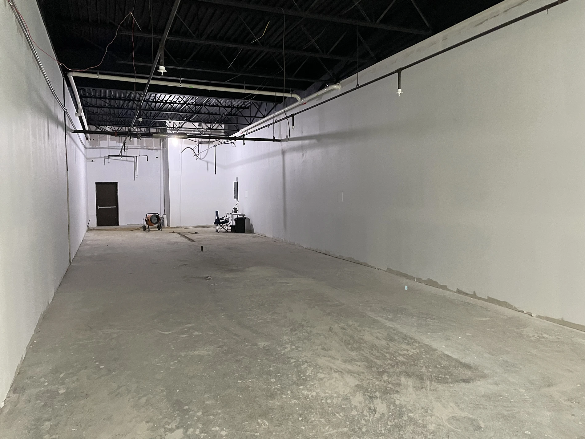 A vacant tenant space where Apex utilized a sub-slab depressurization system to mitigate vapor concerns at the Eastport Plaza.
