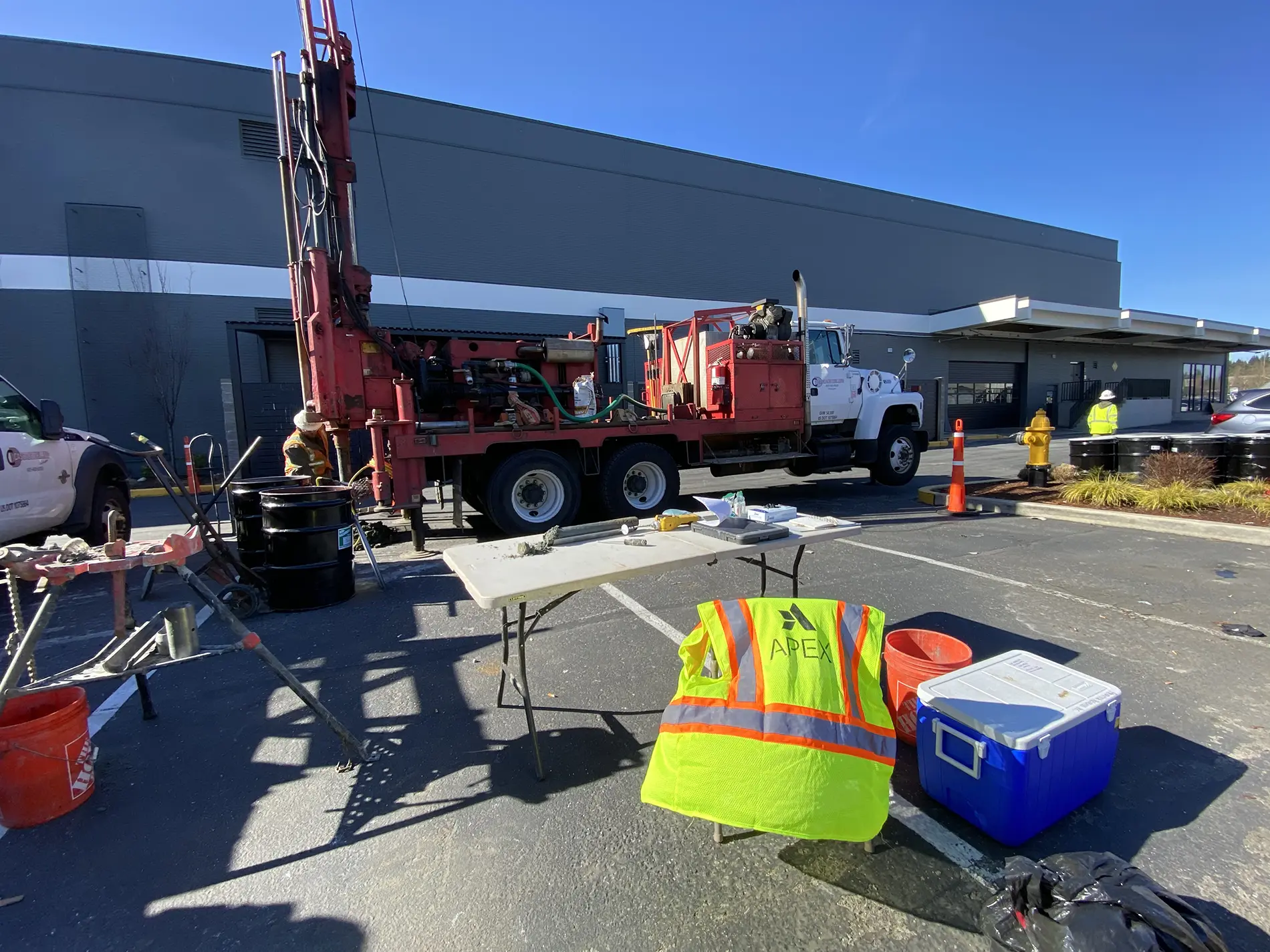 Apex employees operating vapor monitoring point boring machinery during a vapor intrusion investigation, one of the environmental services performed for a retail center expansion in the Puget Sound Region of Washington.