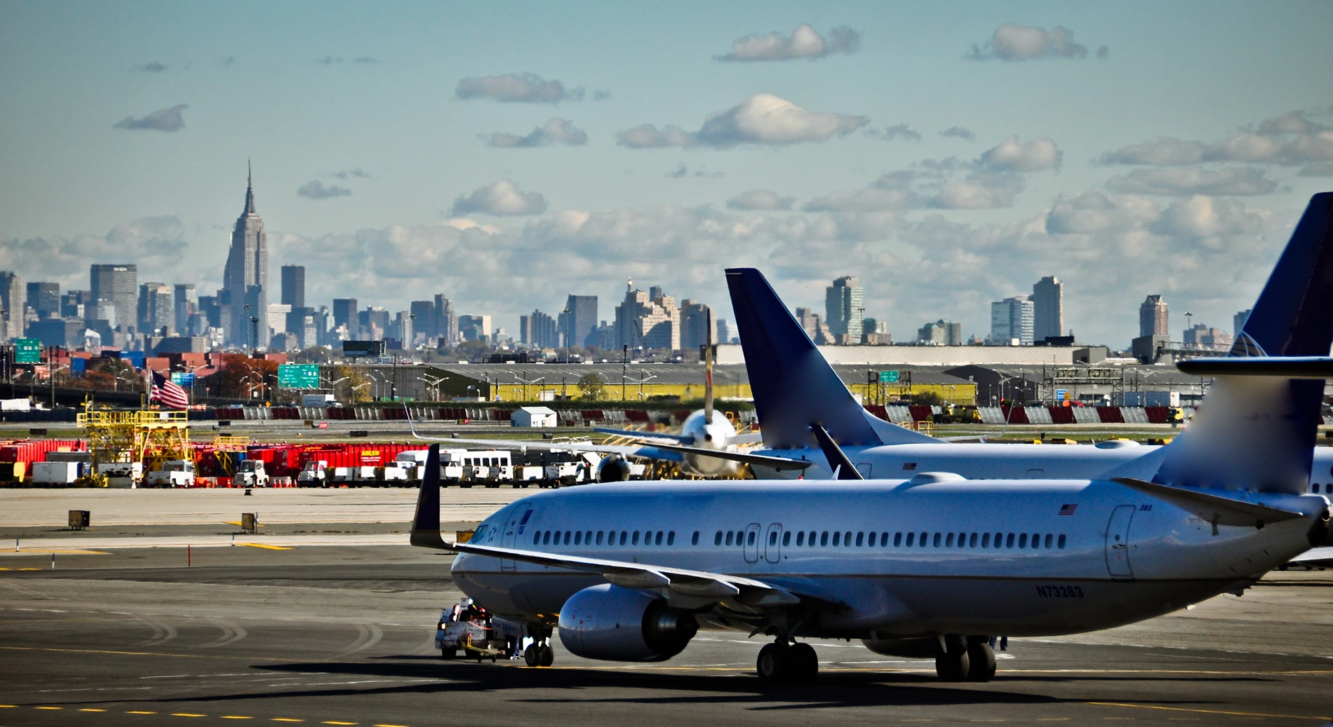 Planes taxiing in front of the New Jersy/New York skyline, impacted by Hurricane Ida and part of Apex's storm damage assessment.