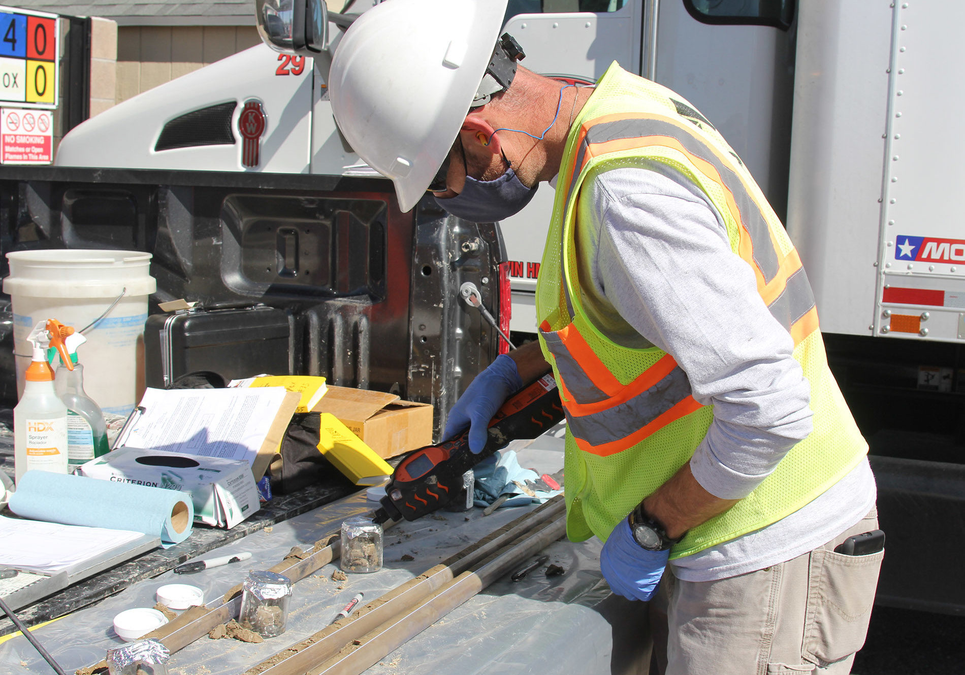 remediation-2 Apex employee performing soil sampling on site